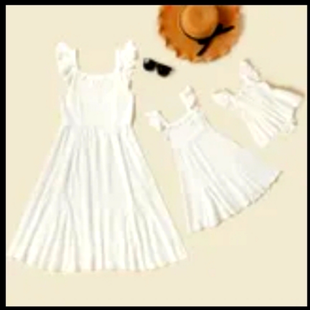 Mother daughter white matching dress and onesie.